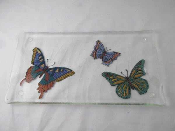 Hand-painted textured tray featuring three colorful butterfly designs.