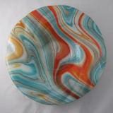 A plate with swirling colors on it