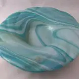 A plate with blue and white swirls on it.