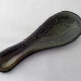 A wooden spoon sitting on top of a table.