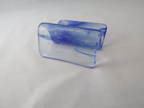 A blue and white glass object sitting on top of a table.