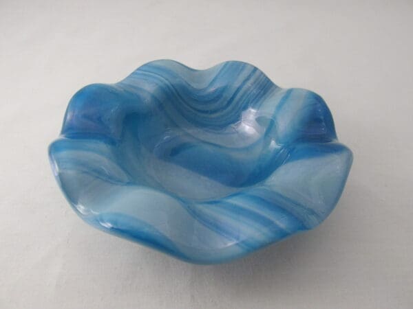 A blue bowl with wavy lines on it.