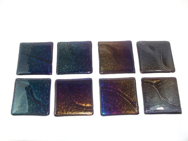 A group of eight square tiles in different colors.