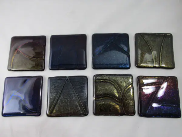 A group of eight square tiles in different colors.