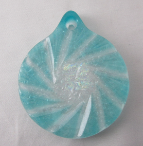 A blue and white swirl pendant on a light blue background.