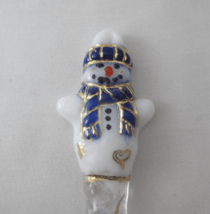 A white and blue snowman with gold trim.