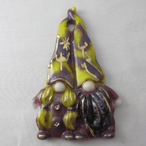 A gnome ornament with yellow and black design.