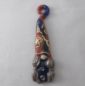 A red, white and blue animal ornament hanging on the wall.