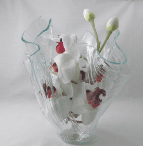 A glass vase with flowers inside of it