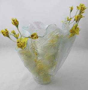 A vase with yellow flowers in it