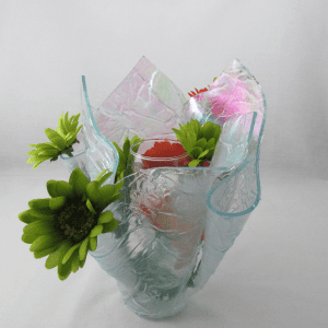 A vase with flowers in it sitting on top of a table.