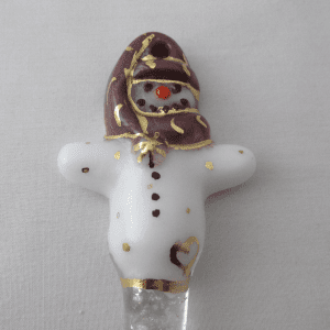 A white and brown ceramic figurine with gold accents.