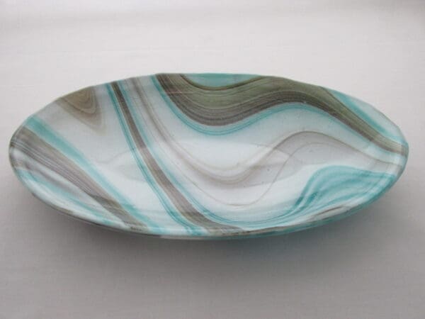 A bowl with blue and white swirls on it