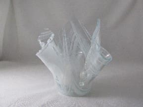 A glass vase with some kind of plastic wrap