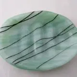 A green plate with black lines on it