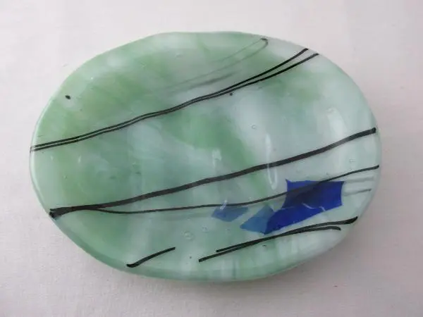 A green plate with blue and black lines on it