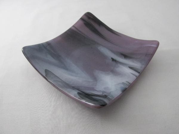 A square dish with a black and white design.