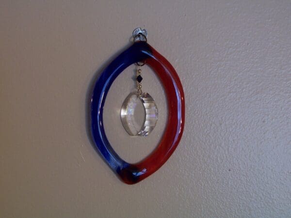 Red & Blue Oval sun catcher with Infinity Crystal