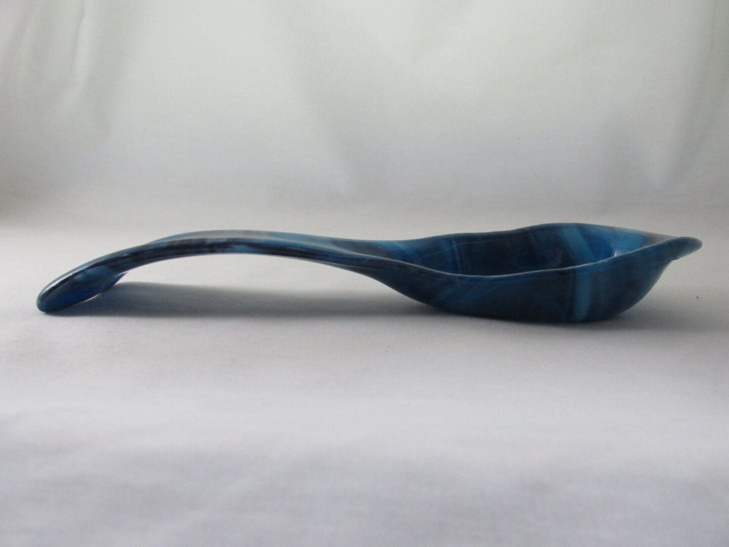 Blue marbled ceramic ladle with curved handle