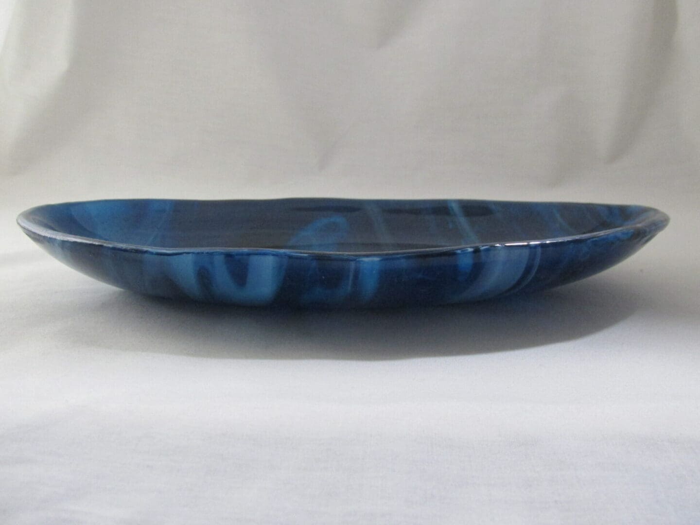 Shallow blue marbled ceramic plate