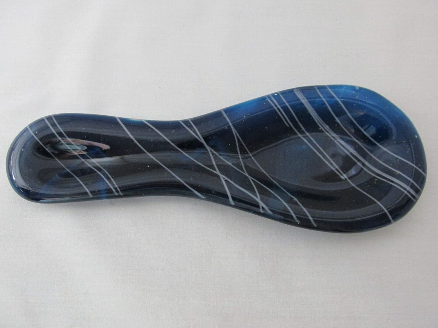 Handblown blue glass spoon rest with swirls