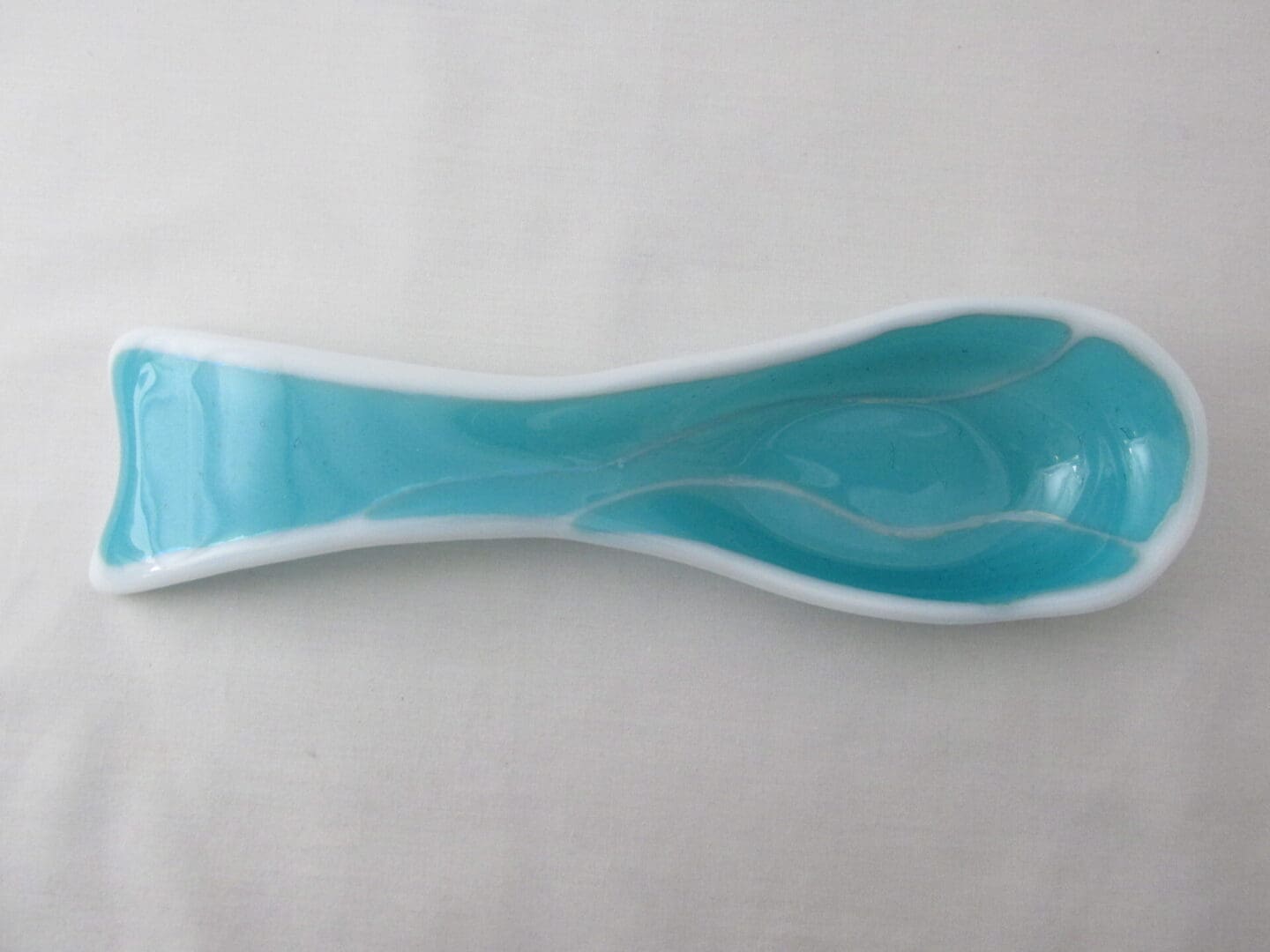 glossy turquoise ceramic spoon rest