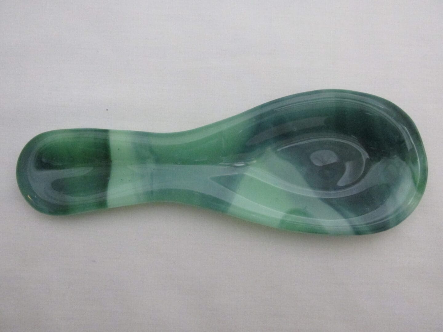 Translucent green marbled glass spoon rest