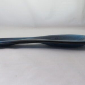 Blue ceramic spoon on white background