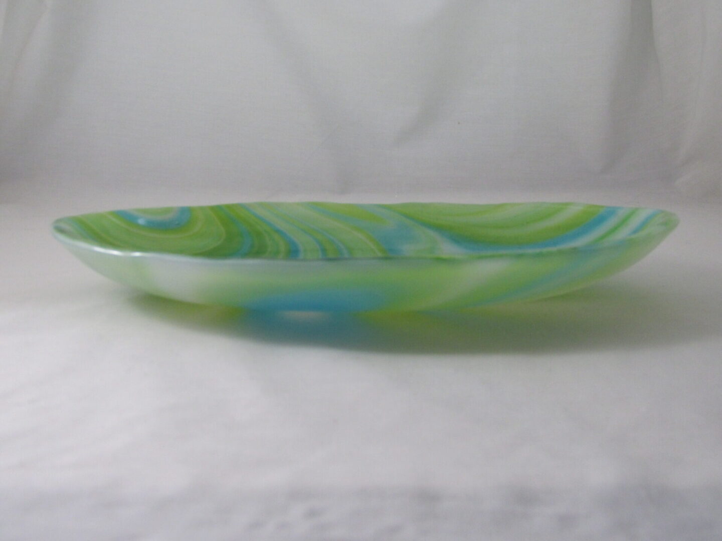 Low-profile green and blue glass dish