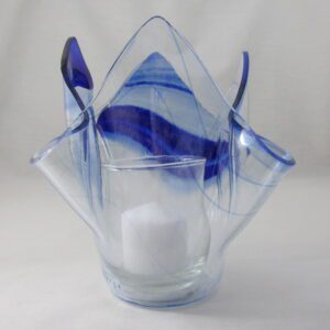 Blue glass votive with white candle