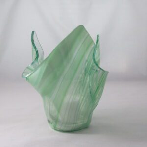 Pale green handblown glass vase with flowing ruffles